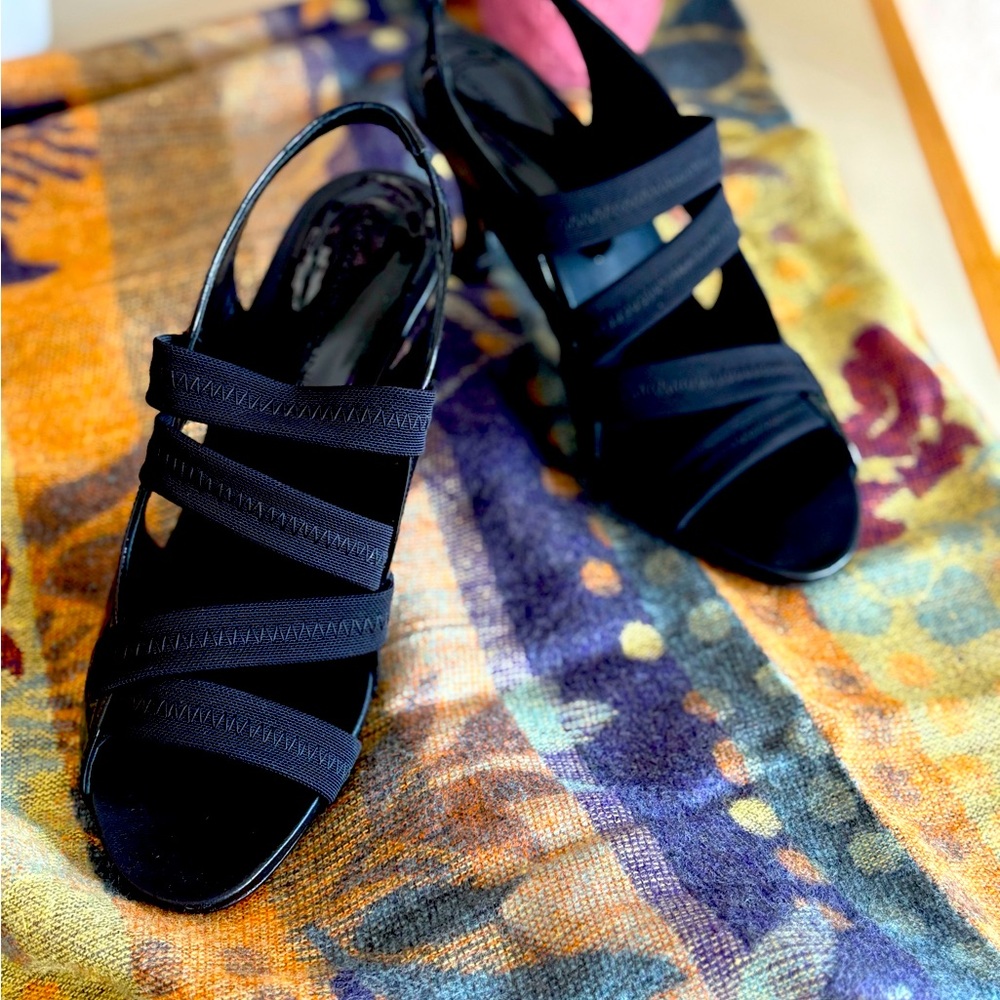 Donald J Pliner black strappy sandals with medium heel height.